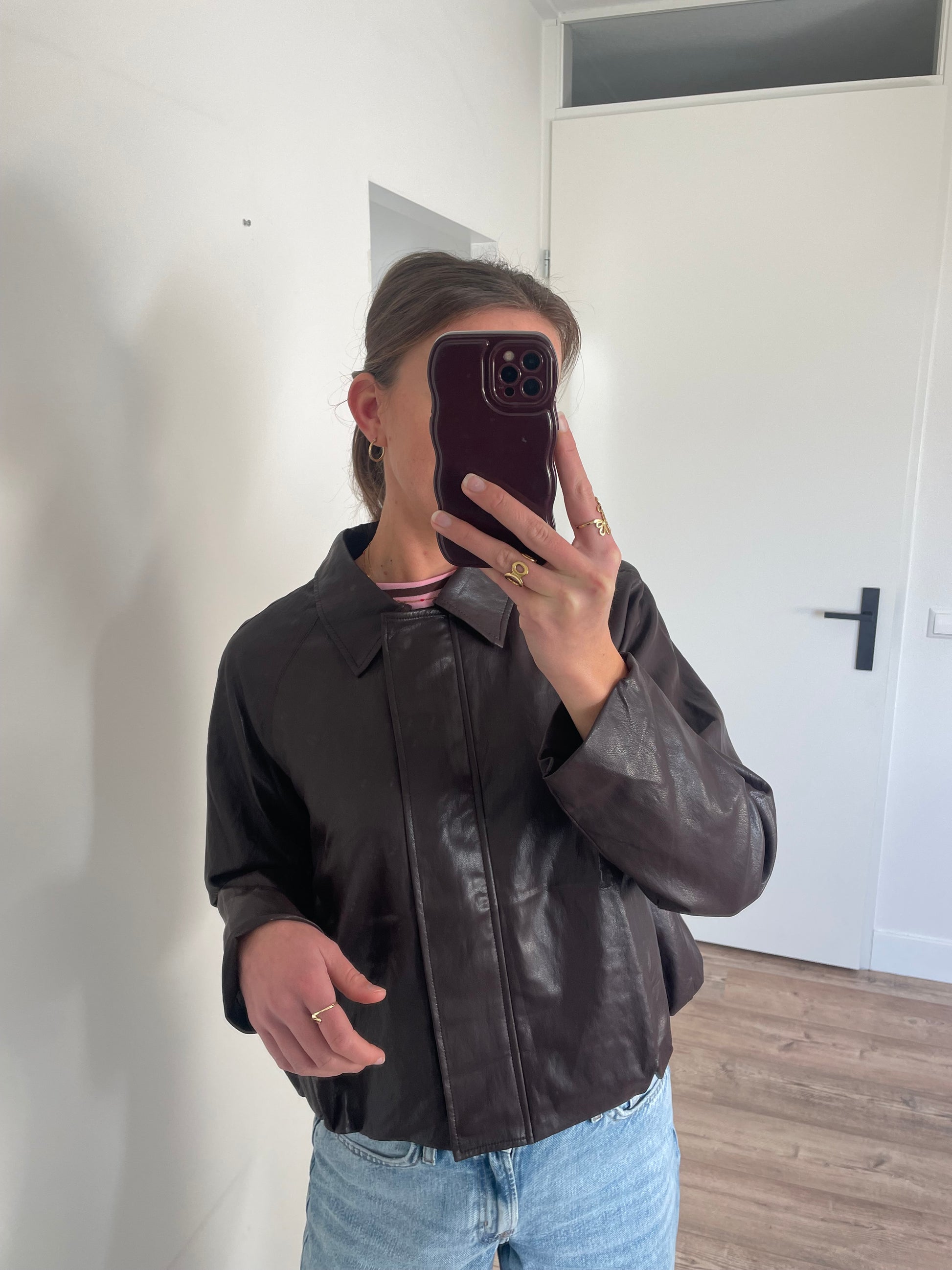 Bomber jas in het bruin met elastieken boord en rits 