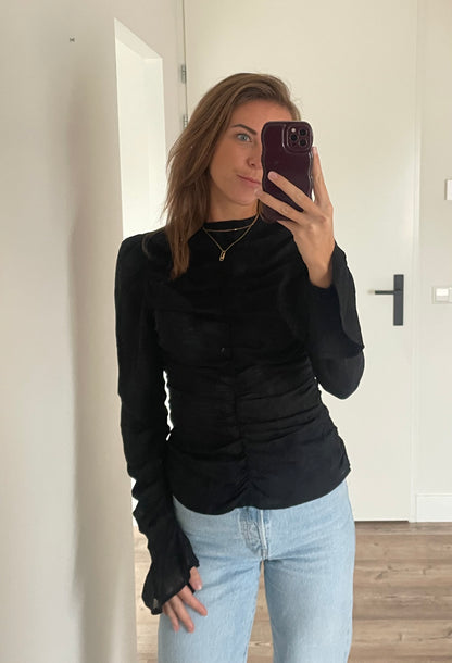 Zwarte blouse met trompetmouwen - By LIV Fashion 